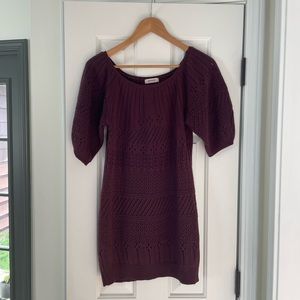 Deep plum, mid thigh sweater dress.